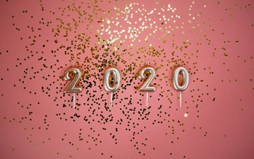 Neujahresvorsätze - Ballons 2020 mit Konfetti auf pinkem Hintergrund